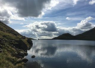 Clouds reflected in water