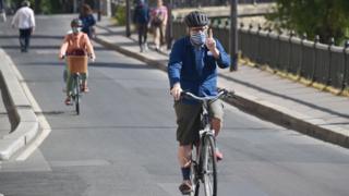 Cyclists in Paris wearing face masks during the coronavirus lockdown
