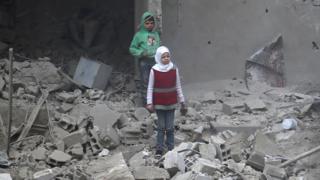 Syrian children in bombed building