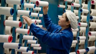 This photo taken on February 22, 2018 shows a woman working in a textile factory in Haian, East China's Jiangsu Province