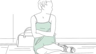 Woman sitting on the floor