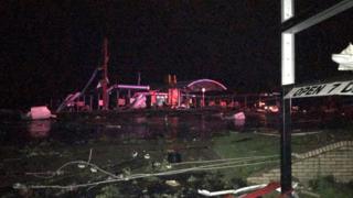 Damage is seen on a street after a tornado in Jefferson City, Missouri