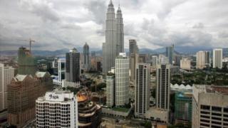 Photo shows the Petronas Twin Towers amongst the skyline of Kuala Lumpur 12 April 2005