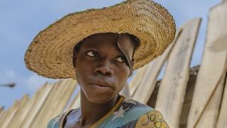 Man with straw hat on his head