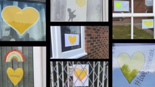 yellow-hearts-in-windows.