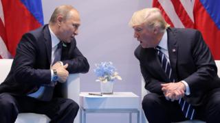 U.S. President Donald Trump speaks with Russian President Vladimir Putin during their bilateral meeting at the G20 summit in Hamburg on 7 July