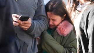 A young girl cries after the incident in New York.