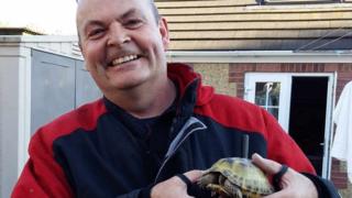 Fireman and rescued tortoise