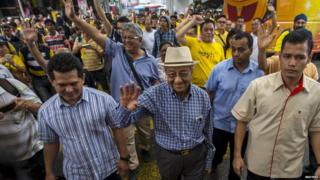 Former Malaysian Prime Minister Mahathir Mohamad waves as he attends a rally organised by pro-democracy group "Bersih"30 August 2015