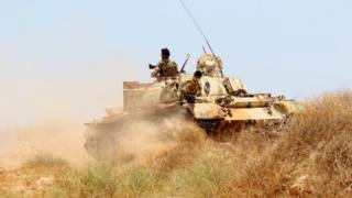 a Libyan tank on a grassy hillside, June 10 2016