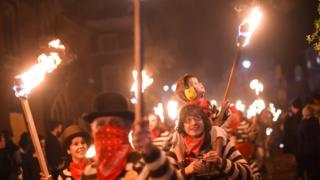 Bonfire societies parade through the streets during traditional Bonfire Night celebrations