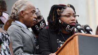 George Floyd's sister Bridgett Floyd speaks as Rev Al Sharpton and Philonise Floyd listen during the March on Washington at the Lincoln Memorial on August 28, 2020 in Washington, DC
