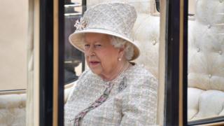 The queen arrives at the parade of color