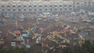 Diggers on the site of the new hospital in Wuhan