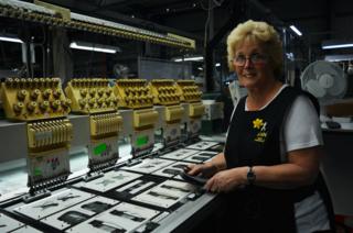 Ann in front of her machine
