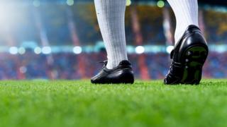 Pies de un futbolista