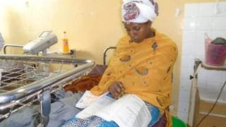 Woman sit for an exam soon after giving birth to her child