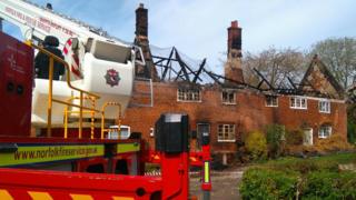The row of burnt-out cottages