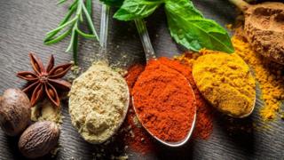 Spices displayed on spoons