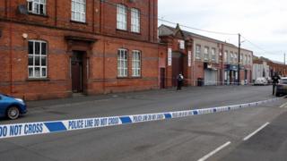 Scene of murder on Victoria Street in Lurgan, police officers present and area cordoned off