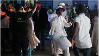 Supporters of Nigeria's President Muhammadu Buhari celebrate in Abuja