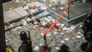 Blood and debris are seen on the ground at the entrance of a shopping mall after a bloody knife fight broke out in Hong Kong on November 3, 2019.