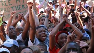 Protesting university students outside court in Cape Town on 22 October 2015