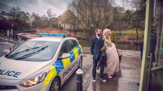Bride and Groom escorted by police