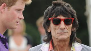 Prince Harry talks to Ronnie Wood during the presentation of the Asprey World Class Cup at Hurtwood Park Polo Club on July 17, 2010 in Ewhurst, England.