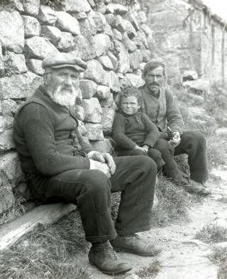 Finlay Gillies, the oldest resident on St Kilda at 74, with his son and grandson