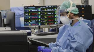 Medical staff at a newly set up intensive care unit in the Poliambilanza hospital in Brescia, Italy, 30 March 2020