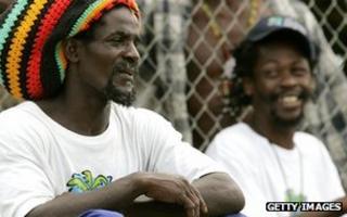Groundstaff look on as the Australian cricket team train on the Caribbean island of St Vincent, 08 March 2007