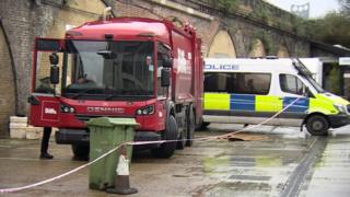Bin lorry and police van