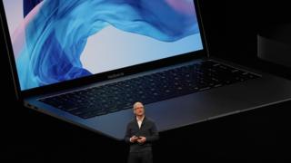 In this file photo taken on October 30, 2018 Apple CEO Tim Cook presents new products, including new Macbook laptops, during a special event at the Brooklyn Academy of Music, Howard Gilman Opera House n New York.