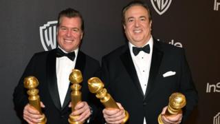 Brian Currie (left) and Nick Vallelonga with their Golden Globes