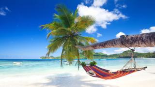 A hammock on a Caribbean beach