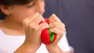 person squishing a squishy