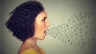 Women with letters coming out of her mouth