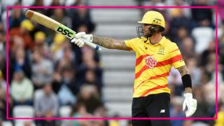 Trent Rockets batter Alex Hales raises his bat to the crowd after hitting fifty