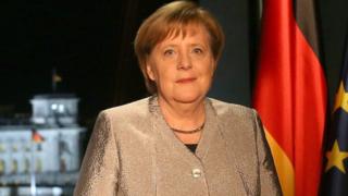 German Chancellor Angela Merkel records her televised New Year's address to the nation at the Chancellery on December 30