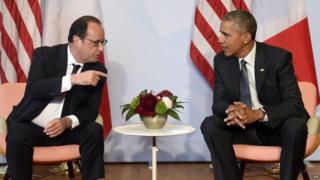 US President Barack Obama (R) and French President Francois Hollande take part in a bilateral meeting on the sidelines of the G7 Summit on 8 June