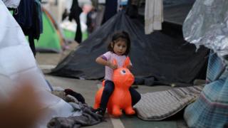 A migrant girl, part of a caravan of thousands from Central America trying to reach the United States, plays in temporary shelter in Tijuana, Mexico, November 23, 2018