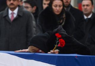 Andrei Karlov's widow Marina weeps on his coffin