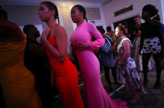 Model Madeline Stuart is prepared backstage before the Colleen Morris presentation