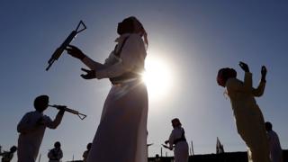 Emiratis dance the yola during the Sheikh Sultan Bin Zayed al-Nahyan Camel Festival on the outskirts of Abu Dhabi on 15 February 2013