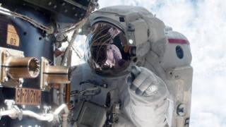 science NASA astronaut Mike Fossum carries out maintenance during a space walk at the International Space Station