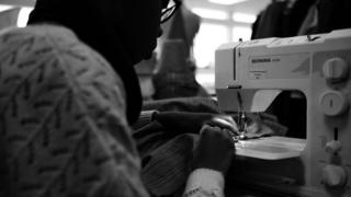 A sewing machinist at work