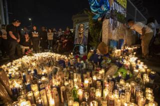 People mourn for rapper Nipsey Hussle on 1 April 2019 in Los Angeles, California.