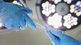 Surgeons in operating theatre