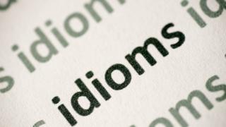 Ilustração com o termo 'Idioms' que significa expressões idiomáticas